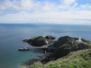 View over cliffs and pier into sea