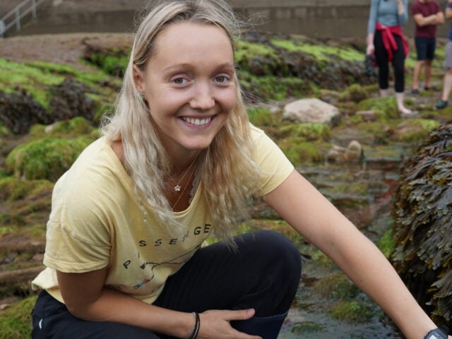 Young woman rockpooling